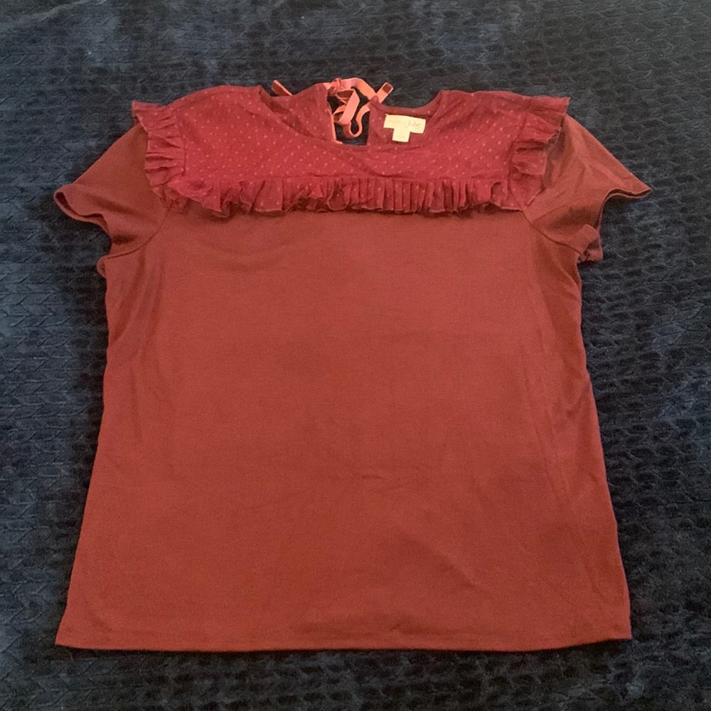 Burgundy T-shirt with ruffle design at top. Size L